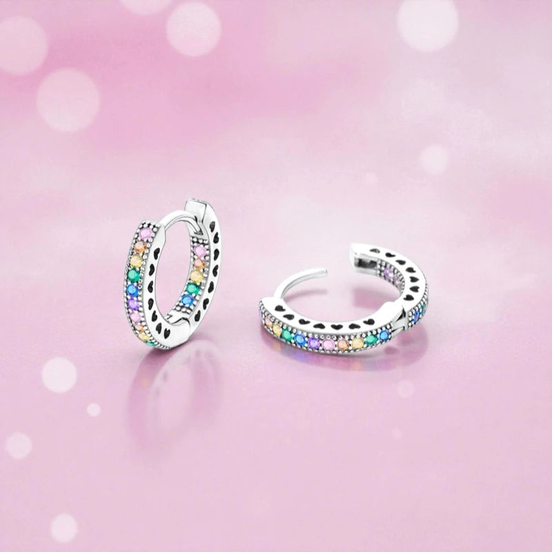 Rainbow CZ hoop earrings featuring shimmering AAA CZ stones in a sterling silver huggie design.