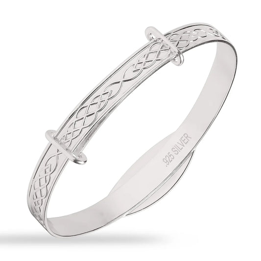 Sterling silver children’s expandable bangle with engraved infinity/Celtic-knot pattern along the band, polished finish, and “.925 SILVER” stamped inside, shown on a white background.