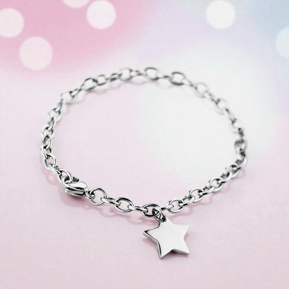 Elegant surgical steel children's bracelets featuring a charming star pendant on a polished chain.