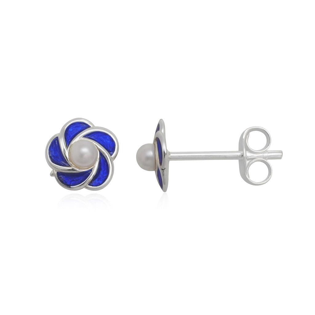 Silver earrings with blue floral design and pearl center on a white background