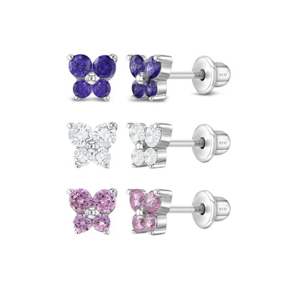 Set of butterfly-shaped earrings with purple, pink, and clear gemstones on a white background