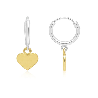 Gold heart charm on a silver hoop earring against a white background