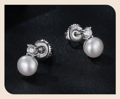 925 silver pearl and Moissanite earrings shown on dark background with secure screw-back design