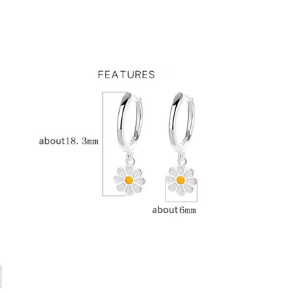 Daisy charm hoop earrings for girls with sterling silver and enamel features, measuring about 18.3mm and 6mm.