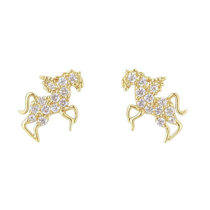 Gold pegasus unicorn-shaped earrings with clear gemstones on a white background