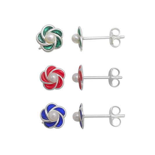 Set of four earrings with colorful swirl designs and pearl centers on a white background