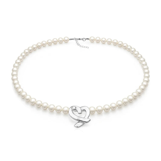 Pearl necklace with a silver heart-shaped clasp on a white background