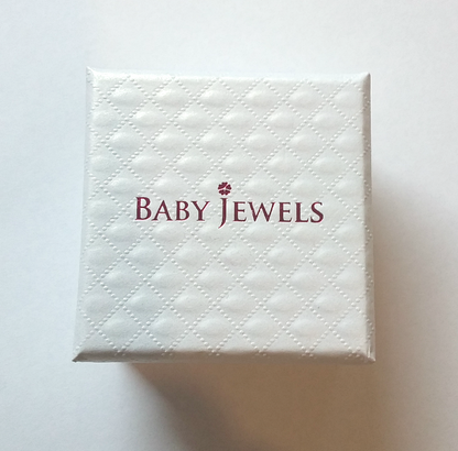 white quilted jewellery gift box with ruby pink Baby Jewels logo on the lid