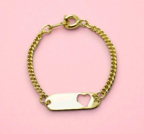 Gold bracelet with a heart-shaped tag on a pink background