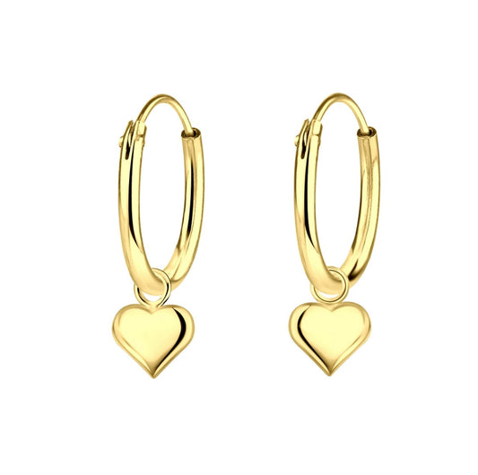 a pair of gold plated children's sleeper earrings with tiny heart charm dangles on a white background