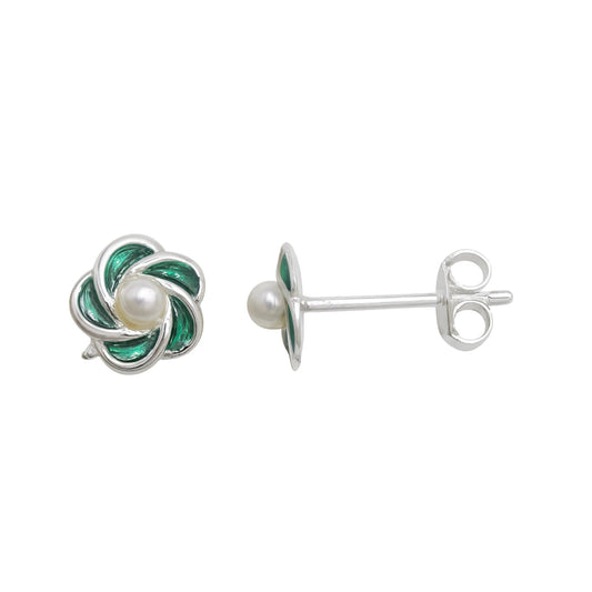 Silver earrings with green enamel and pearl on a white background