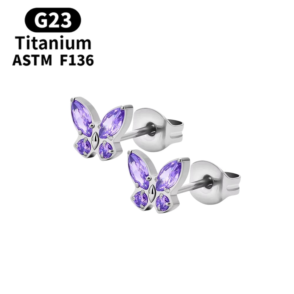 Children's earrings with purple CZ butterfly studs in G23 titanium for kids aged 3 and up.