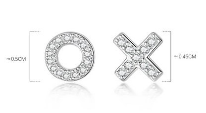 Silver letter 'O' and 'X' charms with clear stones on a white background
