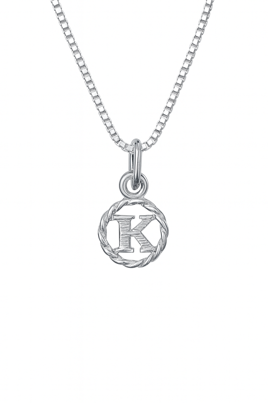 Silver necklace with a circular pendant featuring the letter 'K' on a white background