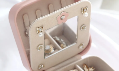Interior of crown jewellery case with ring holder and divider sections