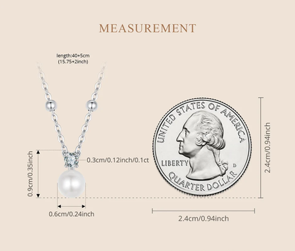 Measurement comparison of pearl pendant necklace next to coin – size for all ages