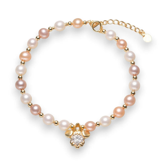 Freshwater pearl bracelet with mouse charm in cream white, pinky apricot, and pinky lavender tones.