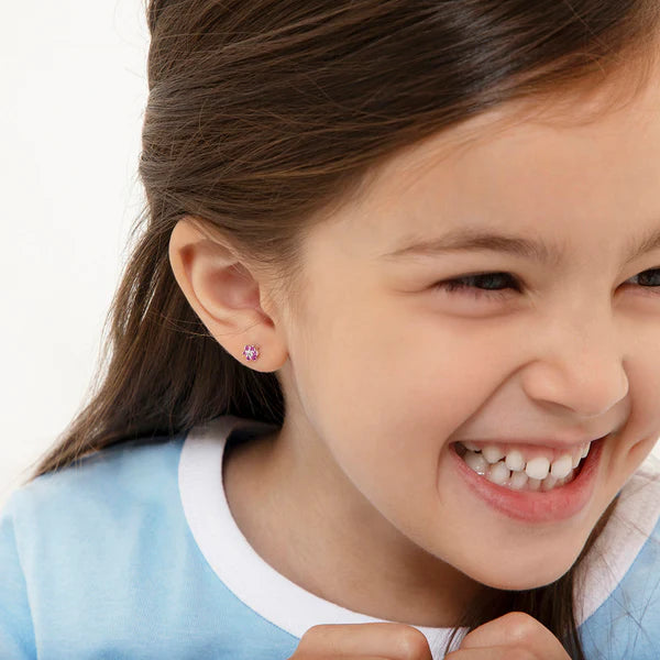 Multicolour CZ Flower Earrings - Sterling Silver Kids on a smiling girl, showcasing colorful sparkly earrings.