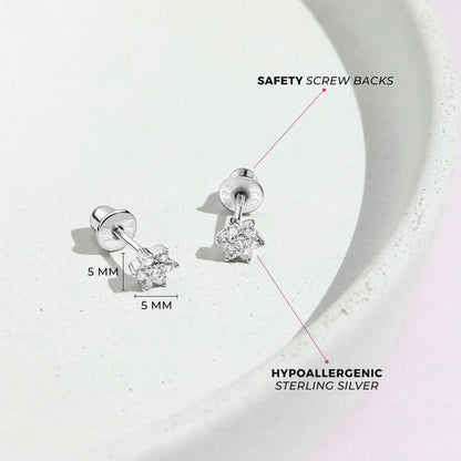Multicolour CZ Flower Earrings displayed on a white plate, highlighting safety screw backs and hypoallergenic sterling silver.