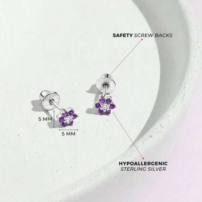 Multicolour CZ Flower Earrings on a plate, showcasing hypoallergenic sterling silver and safety screw backs.