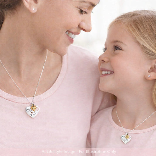 Children's necklaces featuring a mother and daughter wearing sterling silver heart pendants with a gold heart accent.