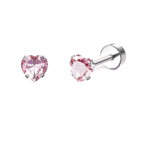 Two heart‑shaped pink cubic zirconia stud earrings on a white background; the left earring is shown face‑on with its faceted pink stone held by four slender silver prongs, and the right earring is angled to reveal its thin sterling‑silver post with partial threading and a smooth screw‑back disc