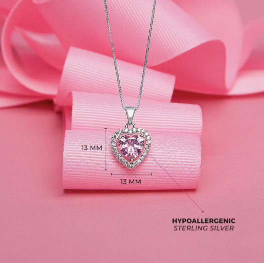 Heart-shaped pink gemstone necklace on a pink ribbon with measurements and 'Hypoallergenic Sterling Silver' text.