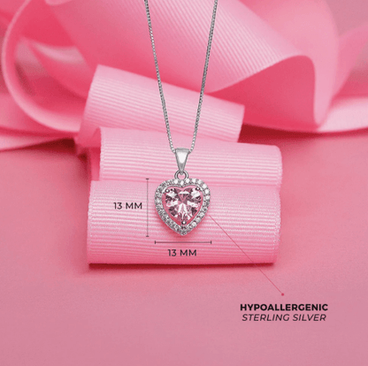 Heart-shaped pink gemstone necklace on a pink ribbon with measurements and 'Hypoallergenic Sterling Silver' text.
