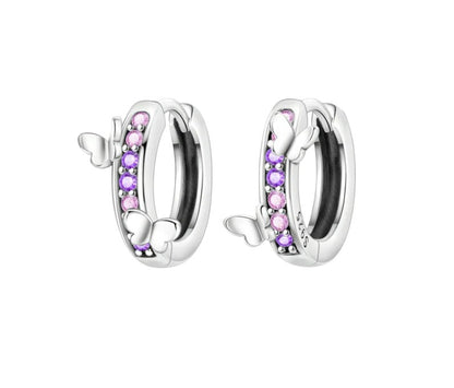 Silver hoop earrings with pink and purple stones on a white background