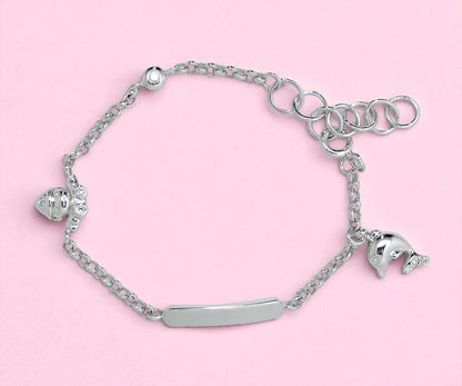 Silver bracelet with charms on a pink background