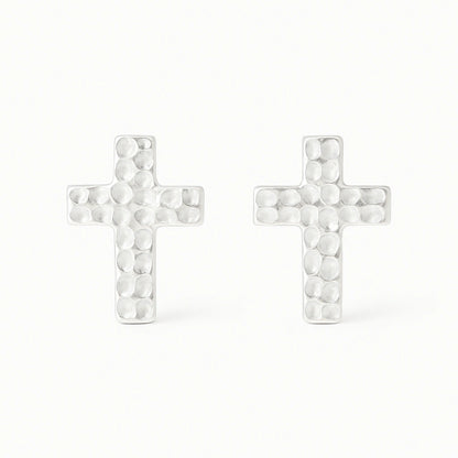 Cross-shaped earrings with a textured design on a white background
