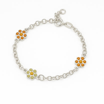 Product shot of a sterling-silver chain bracelet on a pure white background, featuring three enamel daisy charms—two with orange petals and one with pale green petals—linked by oval silver chain links and finished with a lobster-clasp closure.