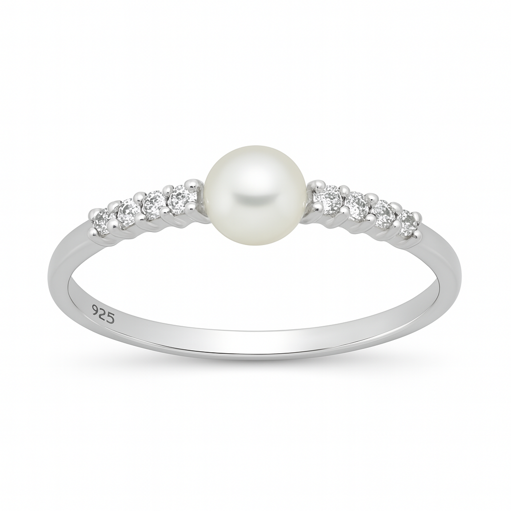A polished sterling silver ring displayed on a white background, featuring a round white pearl at its centre flanked on each side by three small round cubic zirconia stones set into the slender band.