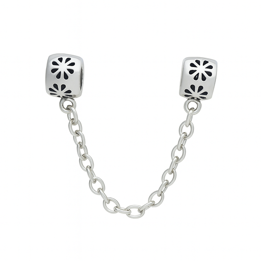 Silver chain with two square links featuring cut-out patterns on a white background