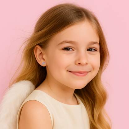 Young girl with blonde hair and a light dress against a pink background