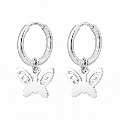 Silver hoop earrings with butterfly charms on a white background
