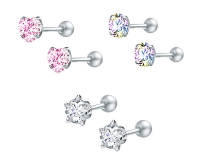 A set of children's earrings featuring various shapes and colours including pink hearts, clear stars, and a multi-coloured round cz, all with screw back closures.