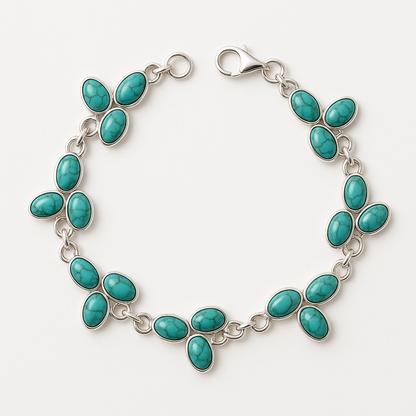 Turquoise bracelet with silver links on a white background