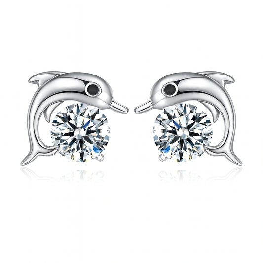 Dolphin-shaped earrings with sparkling clear cubic zirconia on a white background