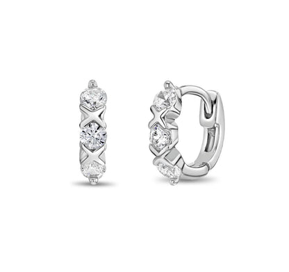 A pair of sterling silver huggie hoop earrings with a XO pattern and clear cubic zirconia stones, displayed against a white background.