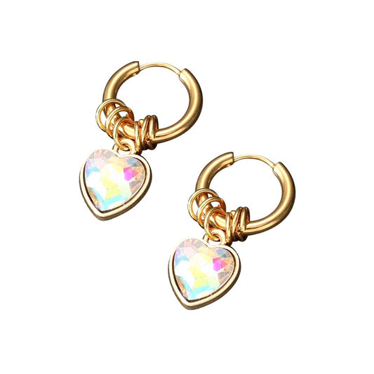 gold plated steel hoops with ring charms and aurora borealis cz heart dangles on a white background