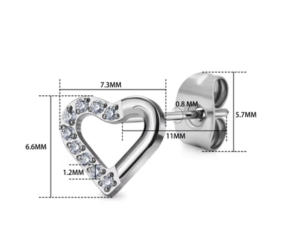 Heart-shaped silver earring with clear gemstones and measurements on a white background