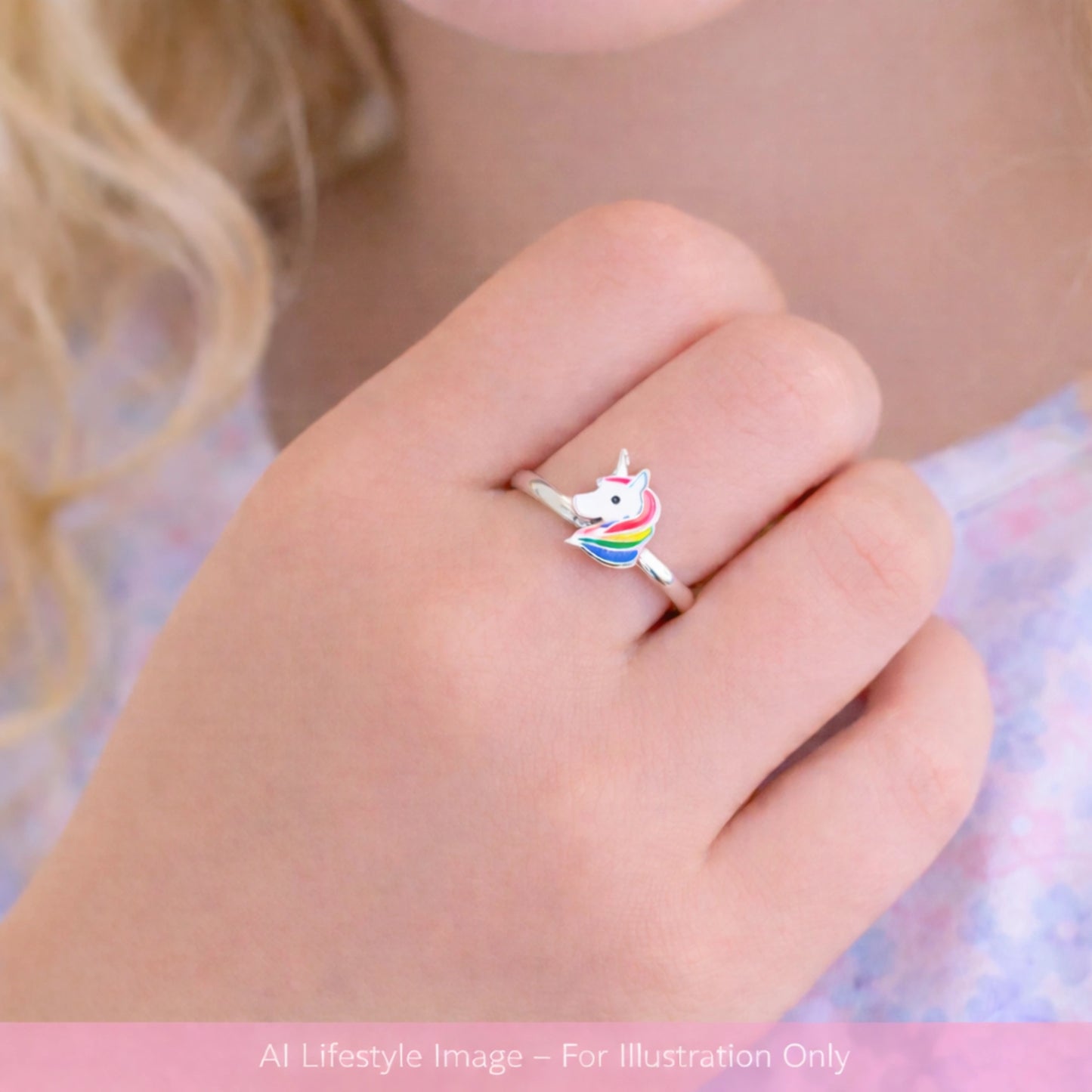 Children's rings featuring a cute unicorn design on a child's hand, crafted from sterling silver with colorful enamel.