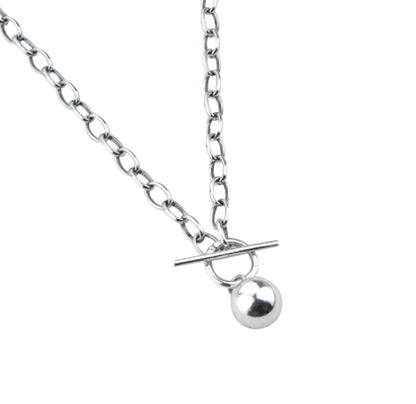 A silver-colored Thai silver ball necklace with a chunky style and a T bar toggle closure, displayed on a chain.
