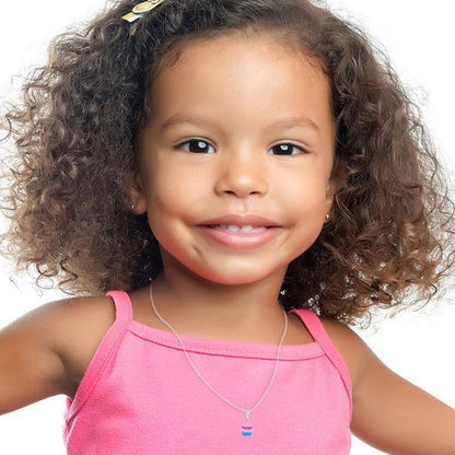 Smiling girl with curly hair wearing a pink tank top and a necklace with a small charm.