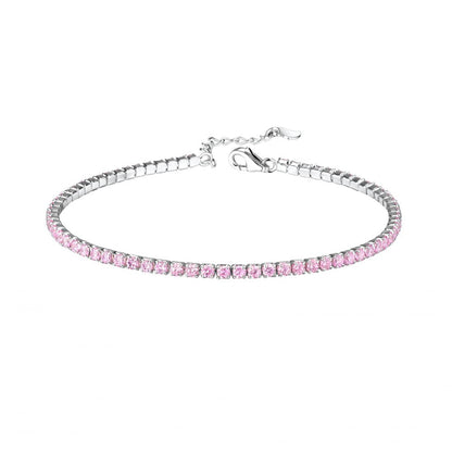 A sterling silver children's bracelet with a pink CZ tennis bracelet design and an extension, featuring a lobster clasp.