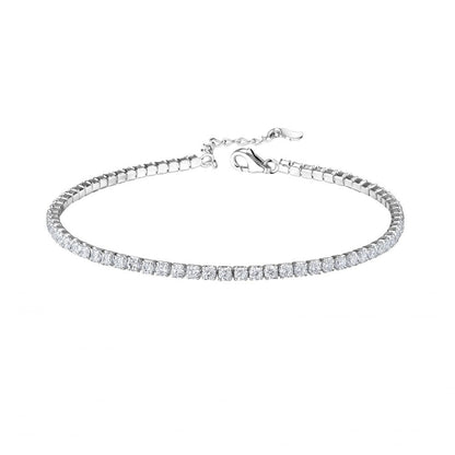 A sterling silver children's bracelet with a clear CZ tennis bracelet design and an extension, featuring a lobster clasp.