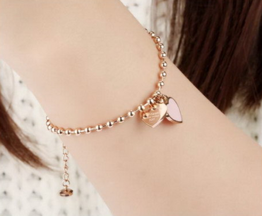 Children's bracelets featuring rose gold IP ball design with heart charms, perfect for kids and tweens.