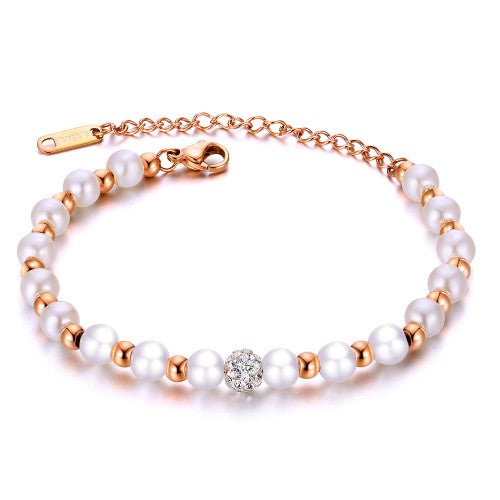 Children's bracelets featuring rose gold IP plating, simulated pearls, and a crystal disco ball bead on a chain.