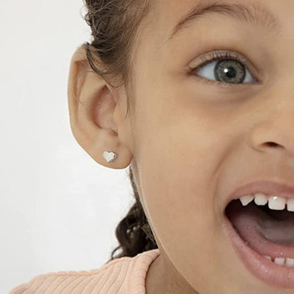 Heart earrings worn by a smiling child showcasing the adorable 6.5x5mm heart design.